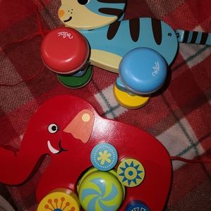 Two wooden toys. Cat and elephant.